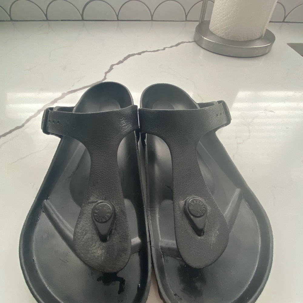 Birkenstock Gizeh EVA sandals in black.